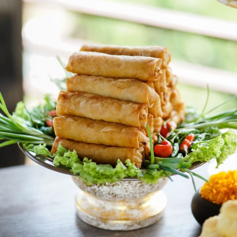 6 Easy Snacks Recipes for Tea Time (Crispy, Tasty & Quick!) crispy spring rolls platter with fresh garnish